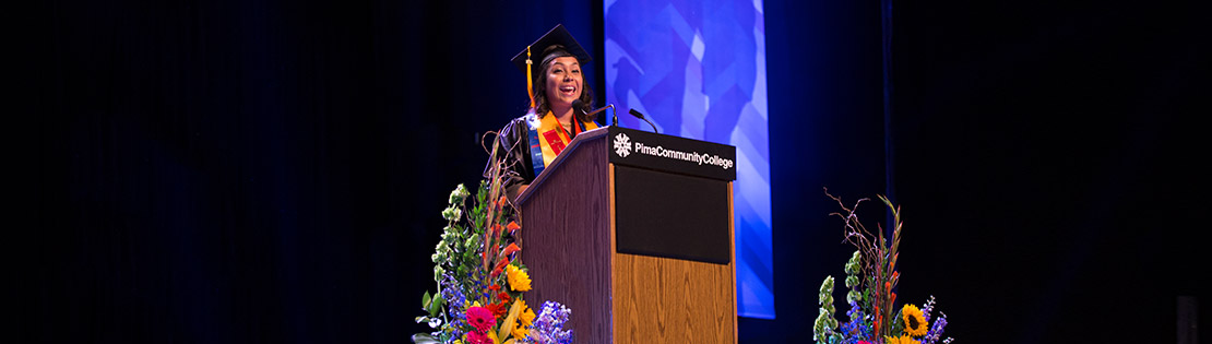 Francy Luna Diaz stands at the podium to give her speech