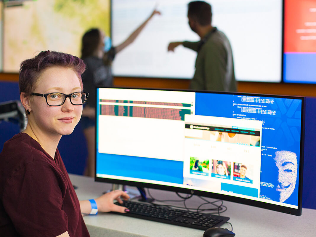 A student smiles in the Fusion Center