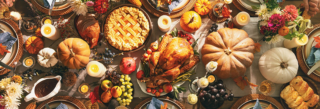 An image of a thanksgiving table full of food