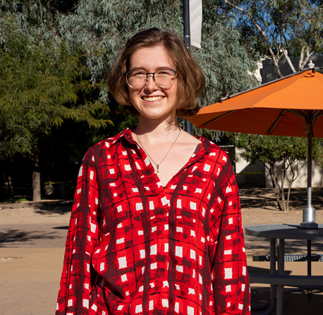 A picture of Taylor Gantz in a courtyard at Pima Downtown Campus