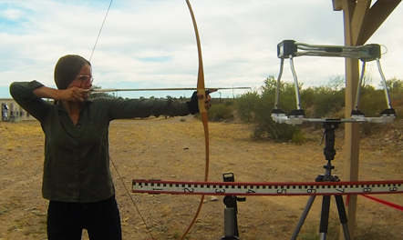 A student uses a bow and arrow with a tracking system