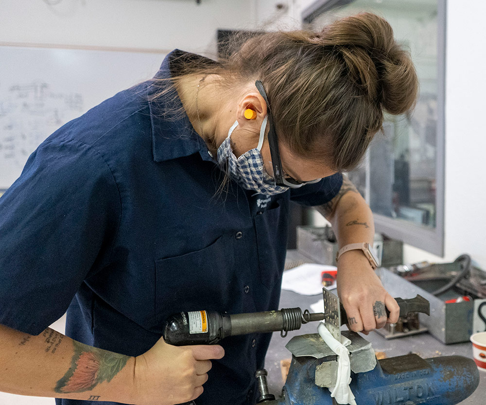 Kathryn Pena uses a workbench at Pima