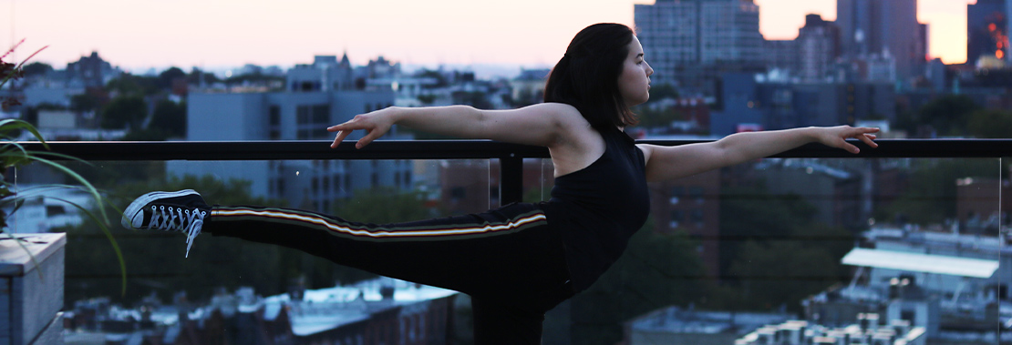 Eva Schmidt does a pose on a balcony in New York