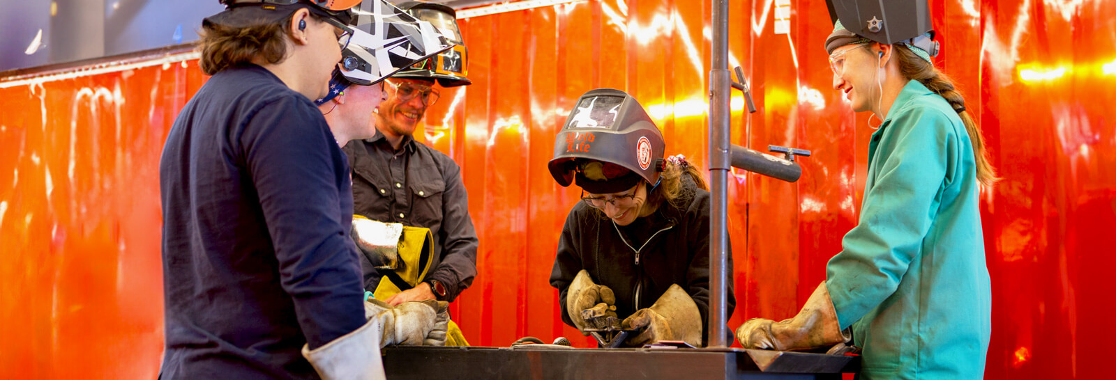 Regina Santaniello teaching welding students. 