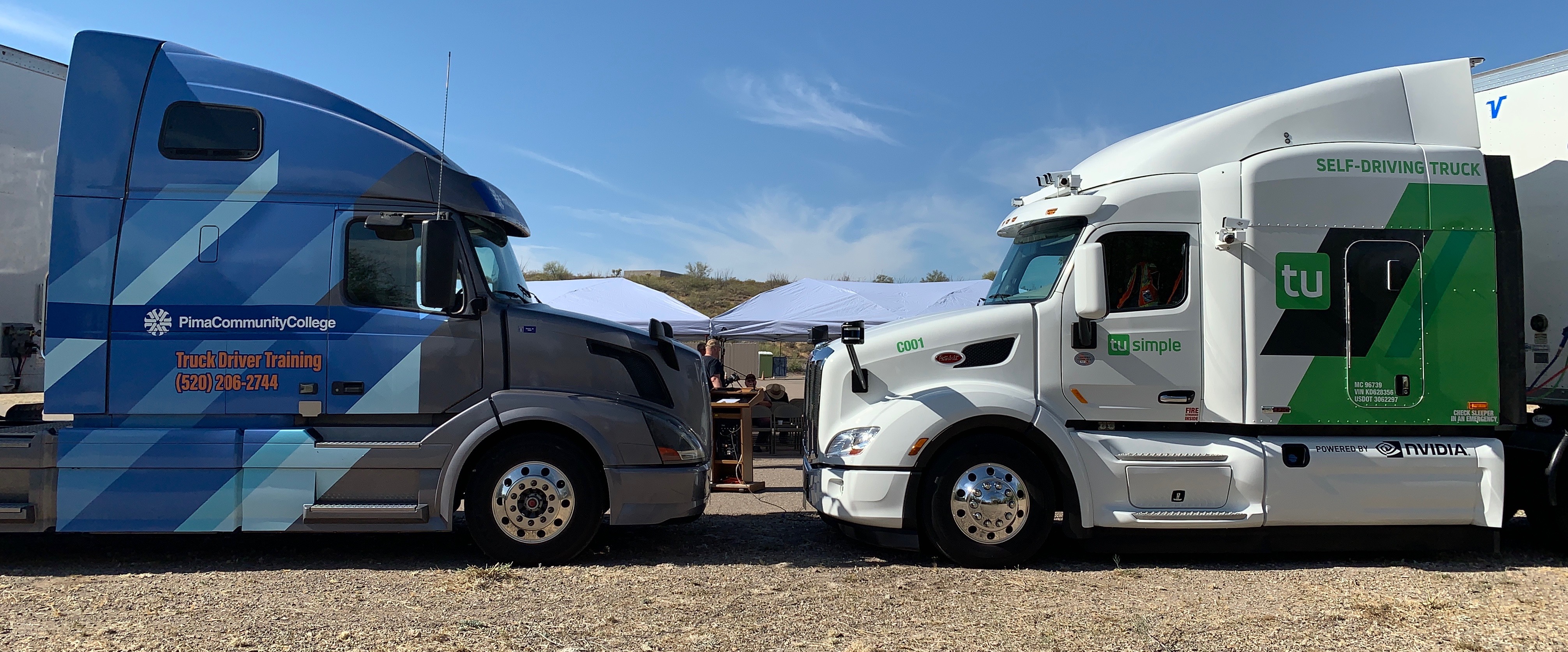 A Pima truck faces a TuSimple industry truck
