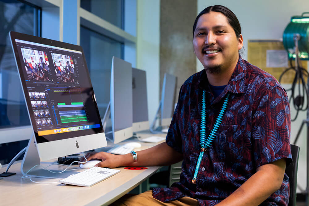 Student working in at an editing console.