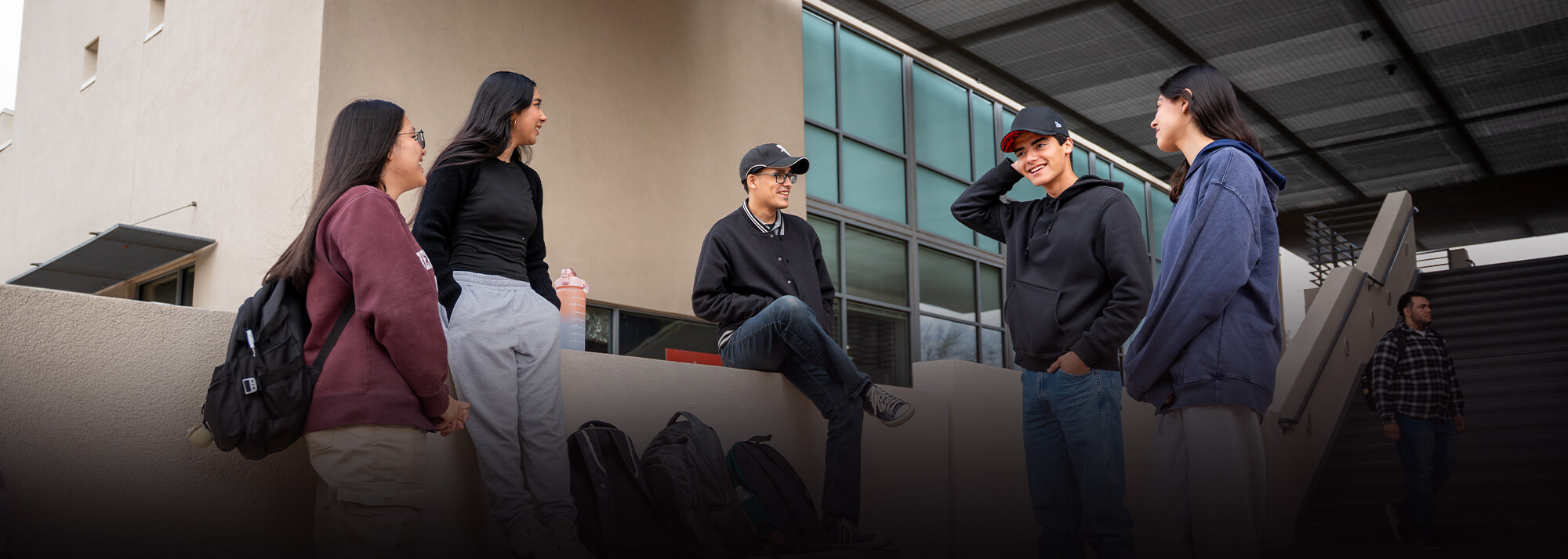 Students sit in breezeway at a Pima Campus
