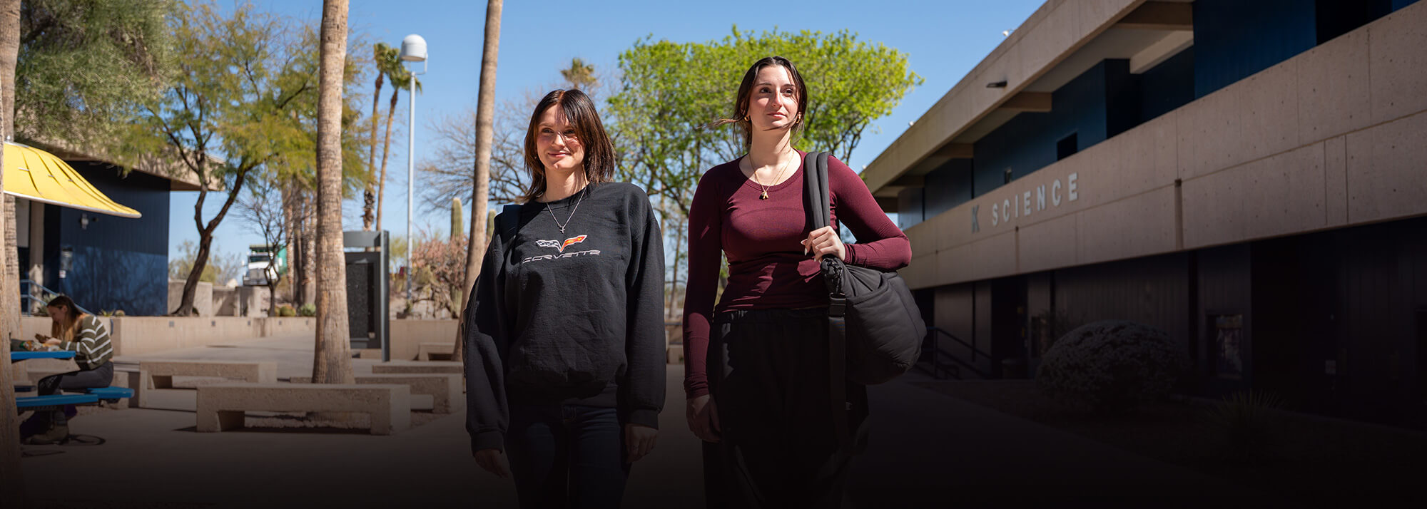 Two Students walk to class in a Pima breezeway