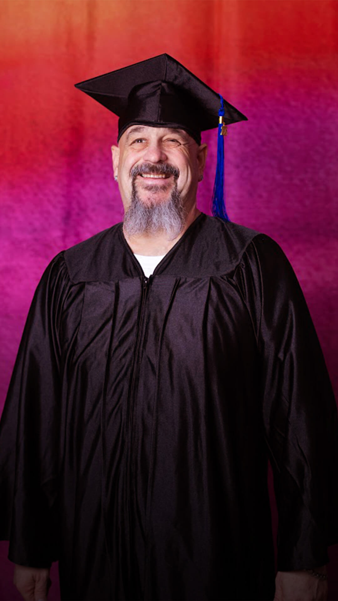 Sam poses for a graduation portrait.