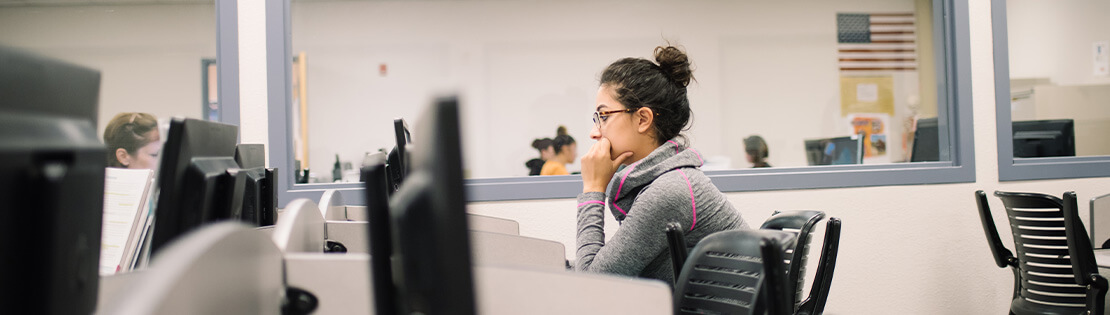 A student in a Pima Student Center works on a computer