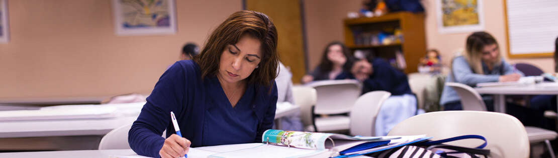 An adult learner studies at a Pima Adult Learning Center