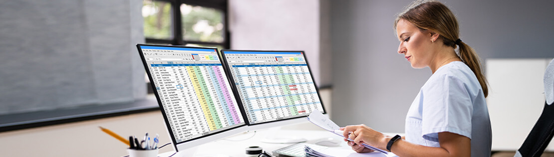 A student nurse works on an excel document on a computer