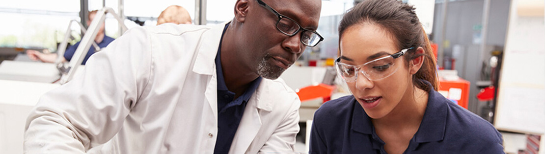 A Pima student works with a mentor in a Pima lab