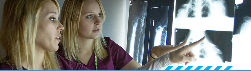 2 radiology students looking at x-rays